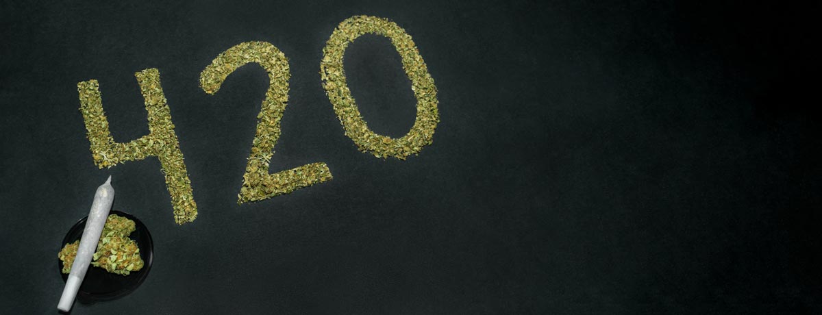 420 written out in weed next to a small bowl of weed and cannabis joint