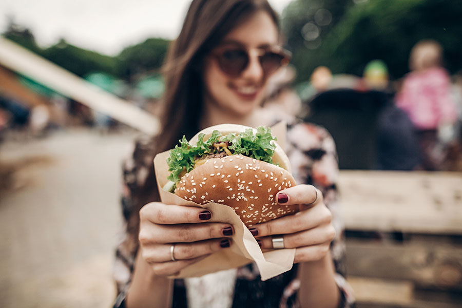 Woman holding a delicious looking hamburger
